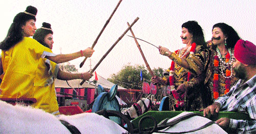 Artistes enact a Ramlila scene during Dasehra celebrations in Ludhiana on Wednesday.
