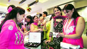 Women shop for jewellery during the festival season in Ludhiana on Friday.