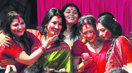 Tollywood actresses take part in 'Sindur Khela' on Doshomi at a Durga Puja pandal in Kolkata on Sunday