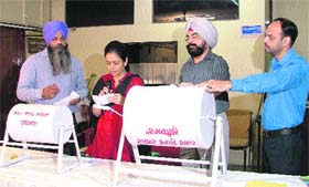 Shruti Singh, chairperson, LIT, and executive officer, LIT, Avtar Singh Azad (second from right), conduct the draw of lots in Ludhiana on Tuesday