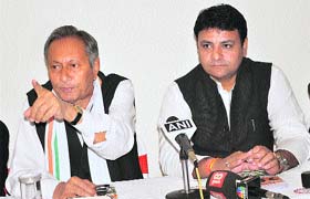 Vijai Singh Mankotia and Sudhir Sharma, Congress candidates, address mediapersons in Dharamsala on Thursday