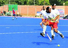 A match in progress during the Inter-University Hockey Tournament at the PAU in Ludhiana.