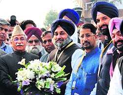 Pakistan Punjabs Assembly Speaker Rama Mohammad Iqbal greets Deputy CM Sukhbir Singh Baal at Wagah border.
