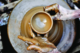 With Divali round the corner, a potter makes earthen lamps in Ludhiana. Tribune