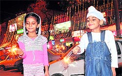 Children play with sparkles on the eve of Divali in Chandigarh