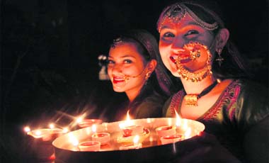 From darkness to light: Girls prepare for Divali puja in Dehradun on Monday