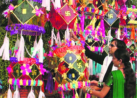 Residents buy decorative lanterns from a market on the eve of Divali on Monday.