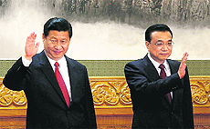 Communist Party General Secretary Xi Jinping (L) with Li Keqiang, the presumptive premier, in Beijing's Great Hall of the People on Thursday.