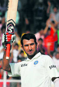 Cheteshwar Pujara celebrates his double century in first Test against England in Ahmedabad.