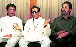 Bal Thackeray with MNS chief Raj and Senas heir apparent Uddhav (R) in this 2002 file photo