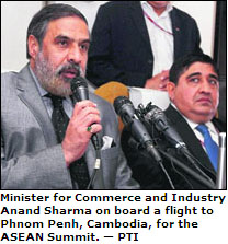 Minister for Commerce and Industry Anand Sharma on board a flight to Phnom Penh, Cambodia, for the ASEAN Summit.  PTI
