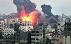 Smoke and explosion are seen after Israeli air strikes in Gaza City on Monday.  Reuters 