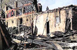 A burnt house in Frislan village of Pahalgam. Apart from houses, granaries and cowsheds were also gutted on Sunday