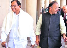 Finance Minister P Chidambaram and BJP leader Arun Jaitley arrive for Mondays meeting