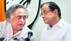 Finance Minister P Chidambaram and Rural Development Minister Jairam Ramesh at a press conference in New Delhi on Tuesday. 