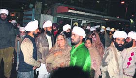Followers of Satguru Jagjit Singh mourn his death outside the SPS Apollo Hospital In Ludhiana on Thursday