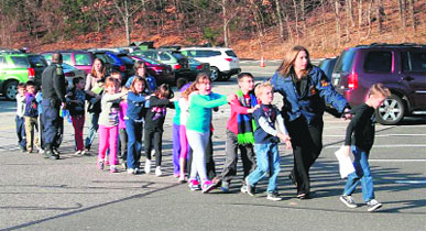 Children being taken away from Sandy Hook Elementary School in Newtown after Fridays shootout.