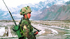 An Indian soldier stands guard near the Siachen glacier close to the Line of Control.