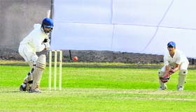 A batsman plays a shot during a match between Punjab and the JKCA at Sector 26 in Chandigarh on Monday