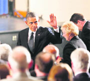 US President Barack Obama with families of victims of the Sandy Hook Elementary School shooting in Newtown, Connecticut, on Sunday.