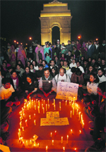 Volunteers came together for a candlelight vigil at India Gate in New Delhi on Tuesday. A Tribune photo 