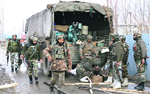 Armymen rush to the encounter site at Sadapora in Sopore on Tuesday. Tribune photo: Amin War