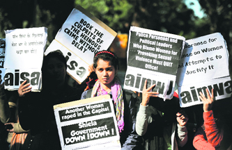 Activists listen a speech outside the Delhi Chief Minister’s residence during a protest in New Delhi on Wednesday following the gang-rape of a student on December 16. The attack sparked new calls for greater security for women in New Delhi.
