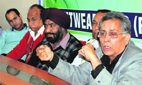 Chairman of the Knitwear Club Vinod Thapar addresses a press conference in Ludhiana on Wednesday