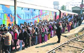 Awareness campaign: School students queue up outside the Red Ribbon Express to get information on HIV/AIDS in Ludhiana on Wednesday