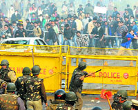 Protesters hurl stones at police personnel during a demonstration against the Delhi gang rape at India Gate in New Delhi. 