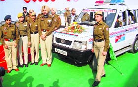 Officials of the Punjab police along with a women helpline van during its launch in Mohali on Saturday