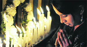 A girl takes part in a candlelight vigil in memory of the gang-rape victim, in Kolkata on Sunday.