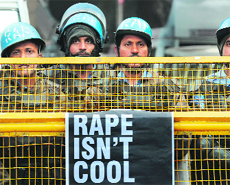 RAF personnel stand behind a barricade in New Delhi on Monday.