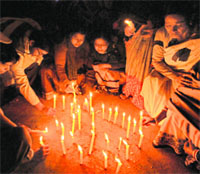 People of Bolpur & Santiniketan take part in a candlelight vigil in protest against the Delhi gang-rape in Birbhum, West Bengal on Tuesday. 