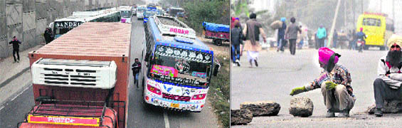 Vehicles caught in a traffic jam on the NH-1 in Ludhiana on Thursday; and (right) protesters place boulders on the highway to block traffic.