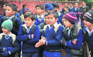 Students come out of their school after the UT Administration declared vacations.