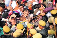 Policemen forcibly intercept agitating employees of the Roadways Department from going to the Chief Minister’s residence in Rohtak on Saturday