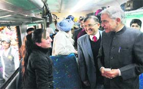 Union Minister Pawan Bansal interacts with a passenger