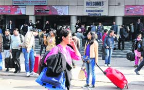 Passengers wait for the Shatabdi Express which was late by an hour at the Chandigarh railway station on Monday
