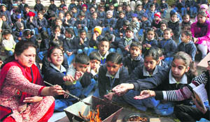 Students take part in a “havan” on the first day of school after the winter break at Firstep Montessori School in Panchkula on Wednesday.