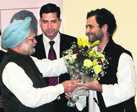 PM Manmohan Singh greets Rahul Gandhi after he was appointed Congress vice-president in Jaipur on Saturday.