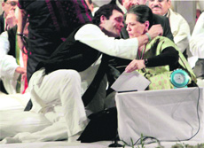 Rahul Gandhi embraces his mother in Jaipur on Sunday.