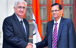 External Affairs Minister Salman Khurshid with his Sri Lankan counterpart GL Peiris in New Delhi on Tuesday.