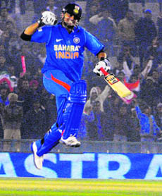 Suresh Raina exults after Indias victory in the fourth ODI in Mohali on Tuesday. 