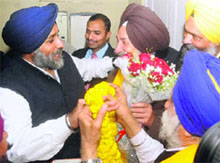 SAD supporters congratulate party president Sukhbir Singh Badal on winning the DSGMC elections at his residence in New Delhi on Wednesday. 