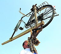 Intrepid Pargat Singh lifts a bicycle with his teeth