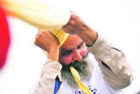 Balwinder Singh, who is visually challenged, ties a turban