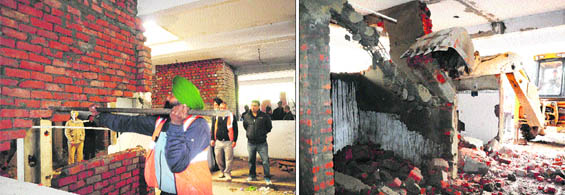 An officer of the Enforcement Wing demolishes an illegal structure; and (right) A JCB machine razes an illegal wall at the day market in Sector 42, Chandigarh, on Wednesday.