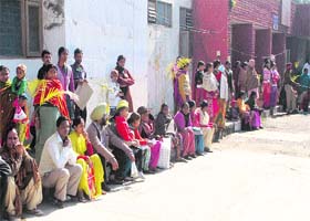 Patients wait for the mock drill to get over at the hospital in Phase VI, Mohali, on Wednesday