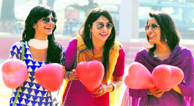 Girls, holding heart-shaped balloons, in a jubilant mood on Valentine’s Day at Panjab University.